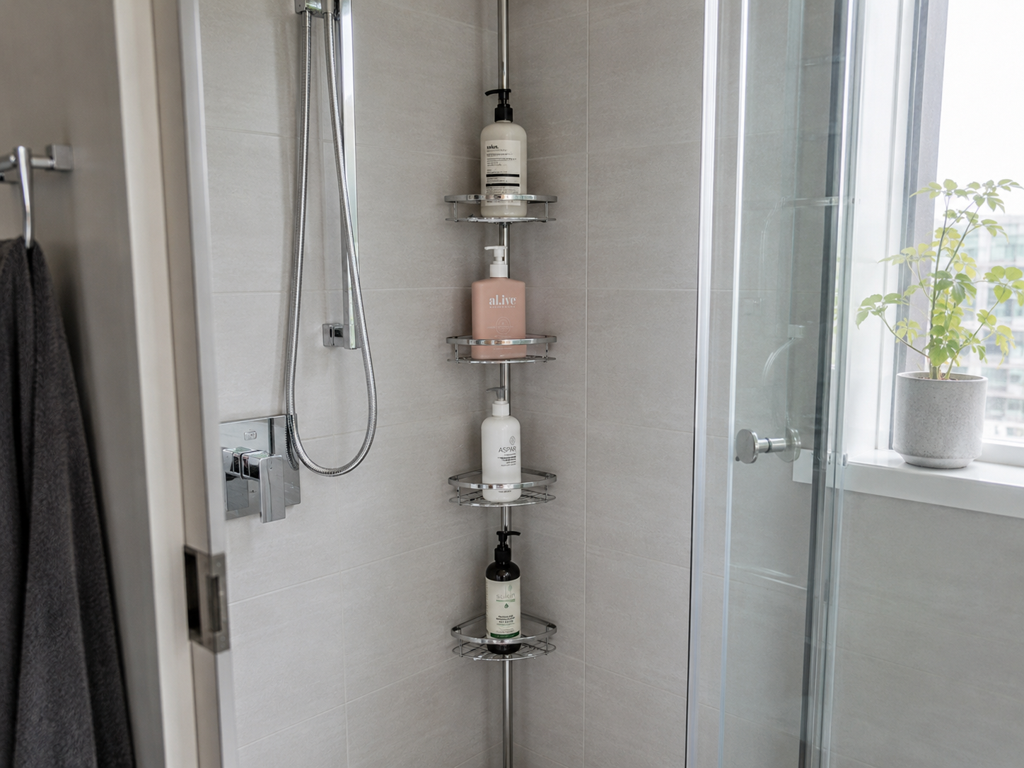 Corner shower caddy storing shampoo and body wash in a compact shower.